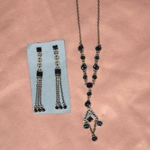 Silver costume jewelry with blue gems.
